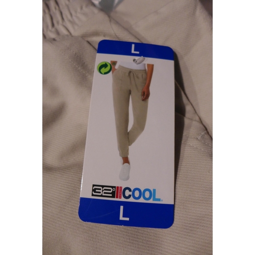 3121 - 10 Pairs of women's 32° Cool cream joggers, size L * this lot is subject to VAT