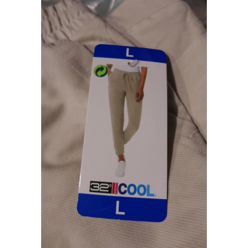 3123 - 10 Pairs of women's 32° Cool cream joggers, size L * this lot is subject to VAT