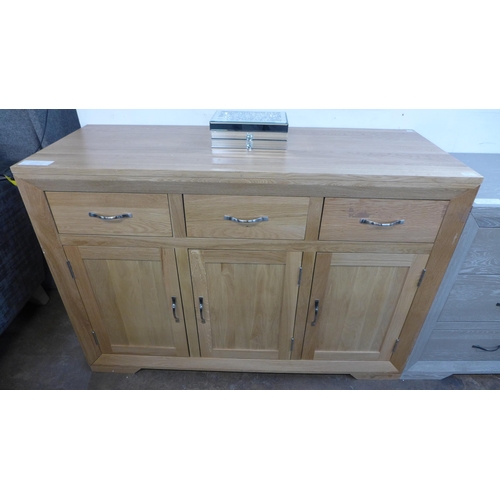 1425 - A Bevel natural oak three door, three drawer large sideboard * this lot is subject to VAT