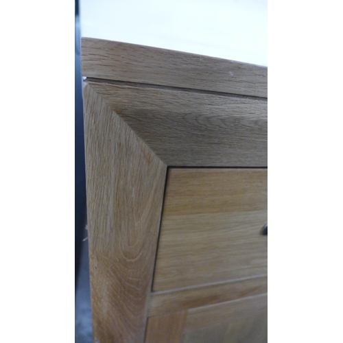 1425 - A Bevel natural oak three door, three drawer large sideboard * this lot is subject to VAT