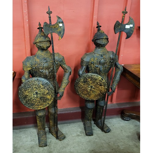 1 - A pair of metal figures of Medieval knights, 140cms h