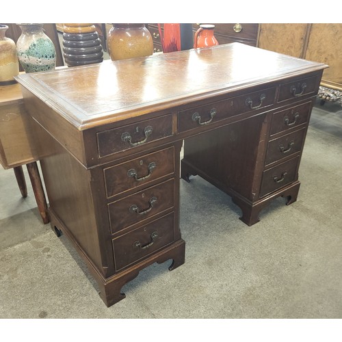 32A - A Victorian mahogany and brown leather topped pedestal desk