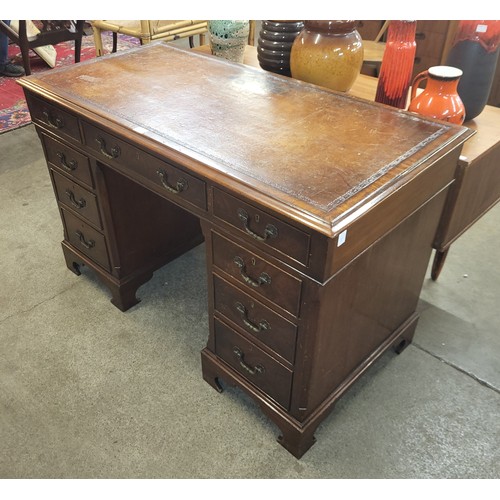 32A - A Victorian mahogany and brown leather topped pedestal desk