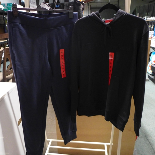 3998 - Men's Champion clothing; black hoodie and navy joggers, both size medium * this lot is subject to VA... 