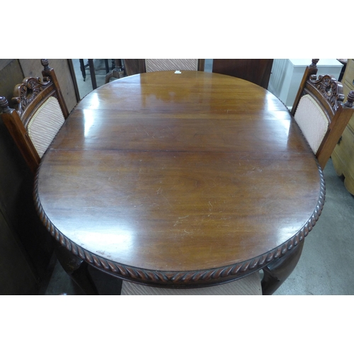 279 - An Edward VII mahogany oval extending dining table and six Victorian carved walnut dining chairs