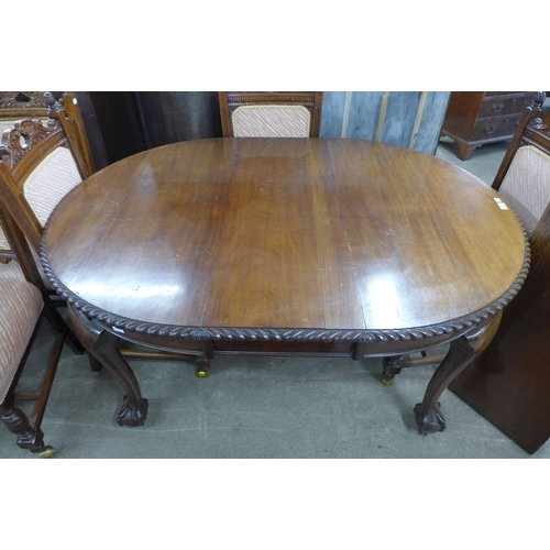 279 - An Edward VII mahogany oval extending dining table and six Victorian carved walnut dining chairs