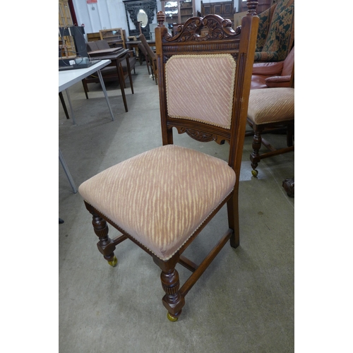 279 - An Edward VII mahogany oval extending dining table and six Victorian carved walnut dining chairs