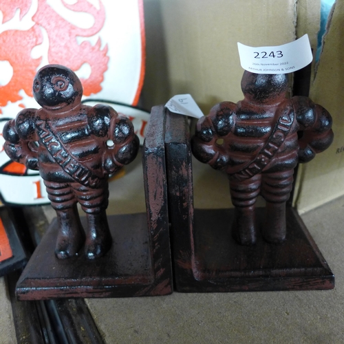 2046 - Brown cast metal Michelin bookends * this lot is subject to VAT