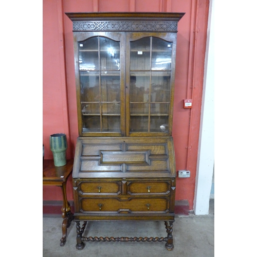 174 - An early 20th Century oak barleytwist bureau bookcase