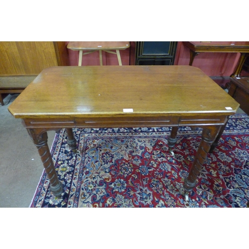 180 - A Victorian Aesthetic Movement oak single drawer writing table