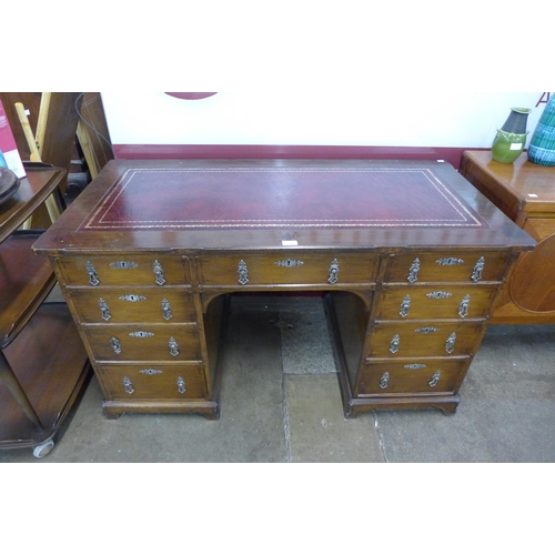 188 - A Victorian Gothic Revival oak and red leather topped desk, manner of A.W.N. Pugin