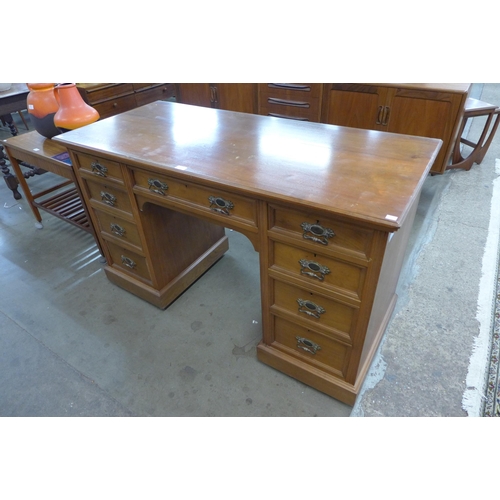 198 - A late Victorian walnut kneehole desk