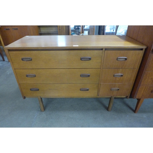 20 - A teak six drawer sideboard