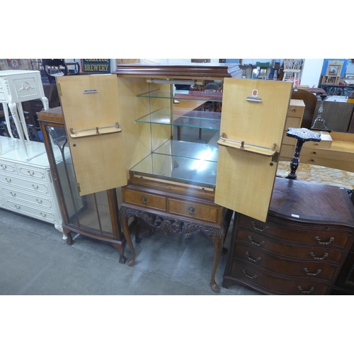 211 - A Queen Anne style burr walnut cocktail cabinet