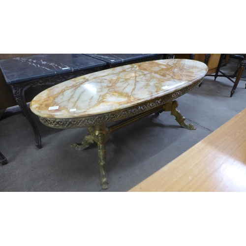 249 - A French style brass and onyx topped oval coffee table