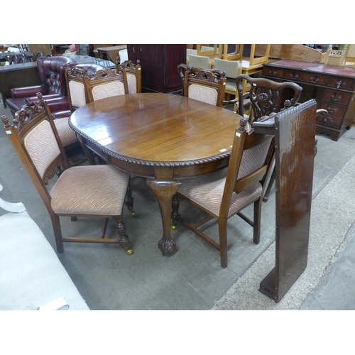 279 - An Edward VII mahogany oval extending dining table and six Victorian carved walnut dining chairs