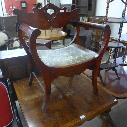 296 - A continental mahogany savaranola style chair