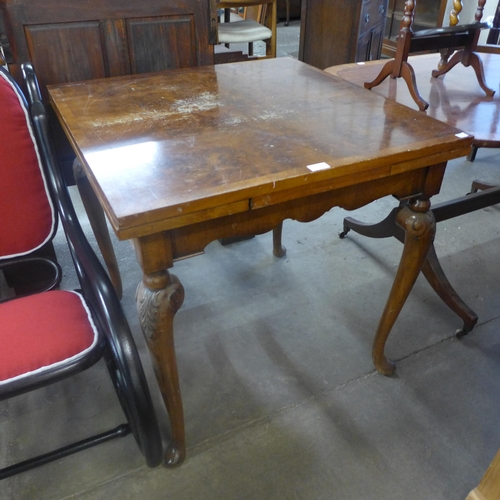 297 - A small Queen Anne style burr walnut draw-leaf table