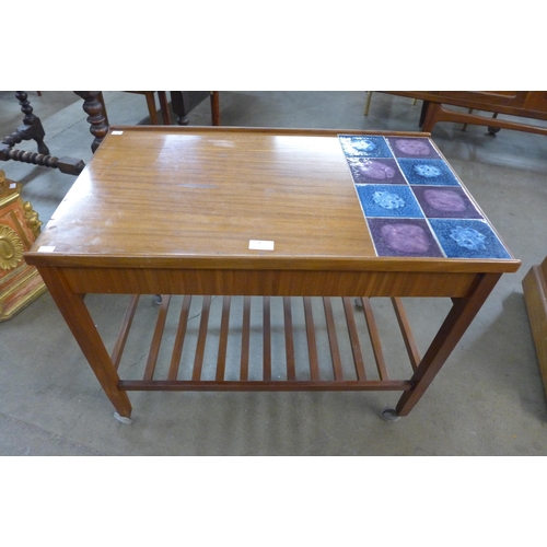 4 - A Danish teak and tiled top two drawer cocktail trolley