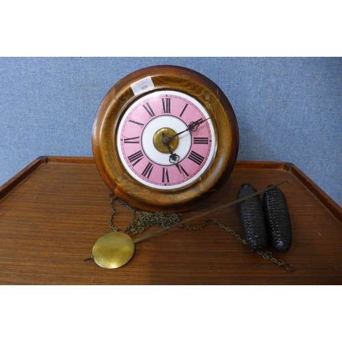 408 - A Victorian circular beech postman's wall alarm clock