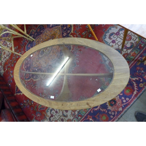 41 - A G-Plan Astro teak and glass topped oval coffee table