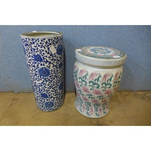 422 - A Chinese porcelain garden seat and a blue and white porcelain stick stand, a/f