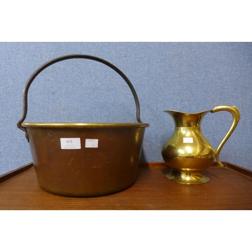 423 - A brass jam pan and a jug