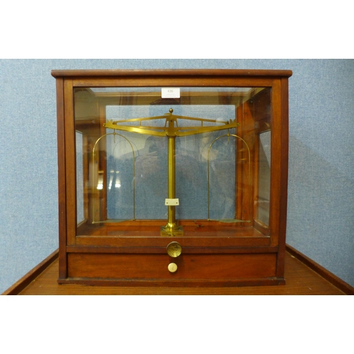 436 - A mahogany cased set of brass chemist's scales