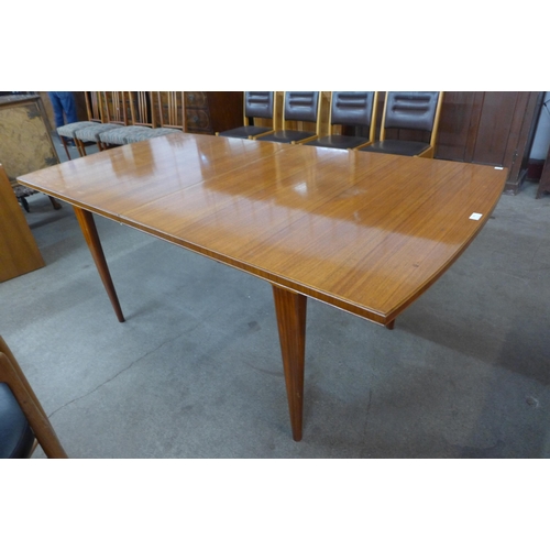 46 - A teak extending dining table