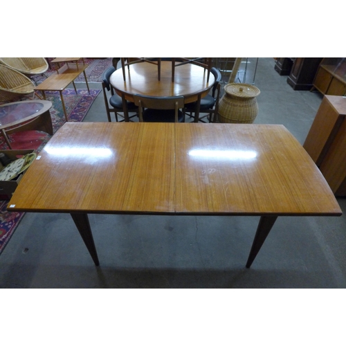 46 - A teak extending dining table