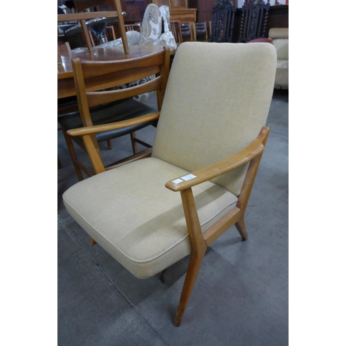 49 - A Scandinavian beech and fabric upholstered armchair