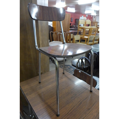 51 - A Belgian Tavo chrome and simulated rosewood extending kitchen table and four chairs