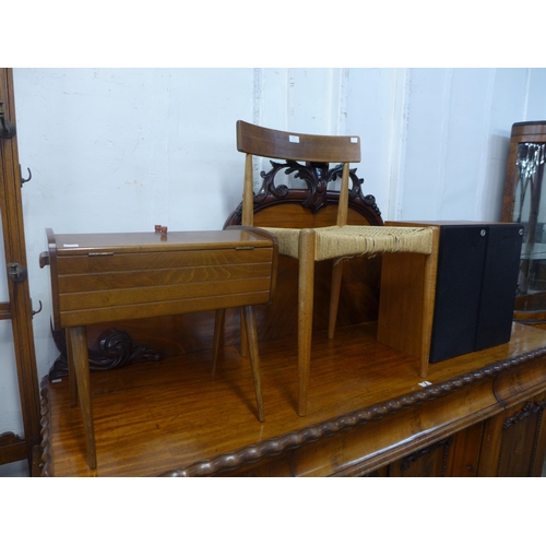 53 - A Danish teak and cord seated chair, a beech metamorphic sewing box and a pair of teak speakers