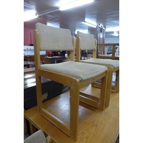 54 - A teak extending table and six chairs