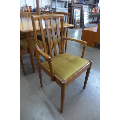 9 - A Meredew teak extending dining table and six chairs