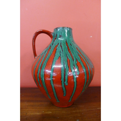 90 - A French 1047 fat lava St. Clement glazed pottery jug