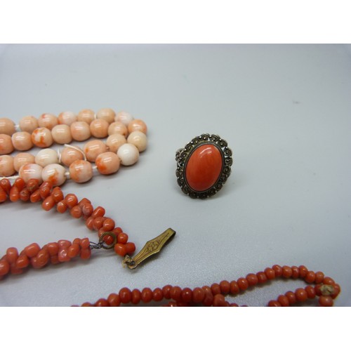 953A - Three coral necklaces, a coral stick pin, ring and pair of earrings