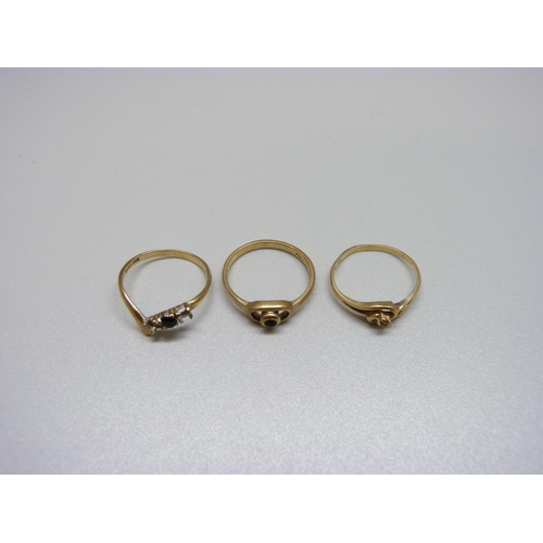 1003 - Two 9ct gold rings and a 14ct gold ring, all lacking stones, 2.9g 9ct, 1.3g 14ct