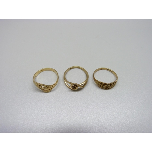 1004 - Two 9ct gold rings, 3.1g, L & M and a 14ct gold ring, 1.9g, N