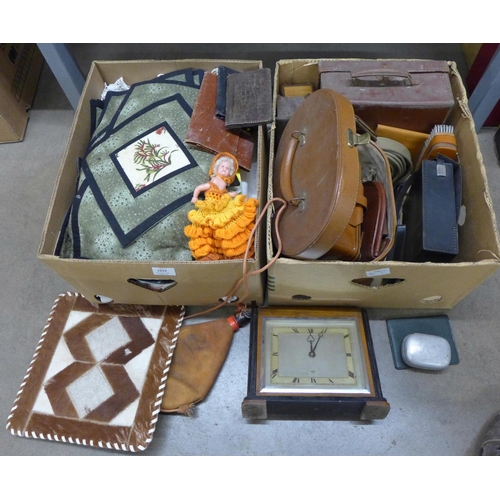 1214 - A box of linen and a box of leather and other goods, Art Deco Elliott mantel clock, etc. **PLEASE NO... 