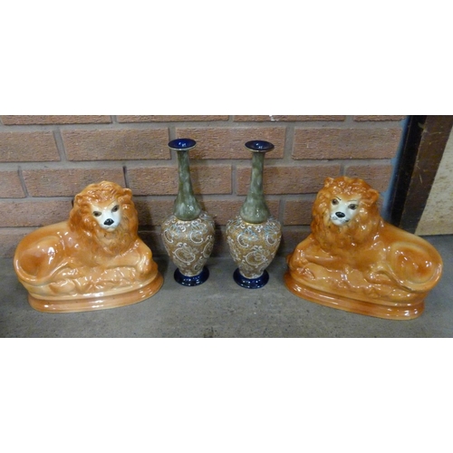 1217 - A pair of Doulton stoneware vases, both a/f and a pair of Staffordshire lions **PLEASE NOTE THIS LOT... 