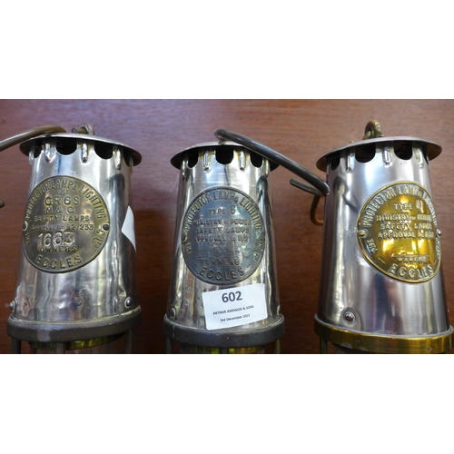 602 - Three miner's lamps