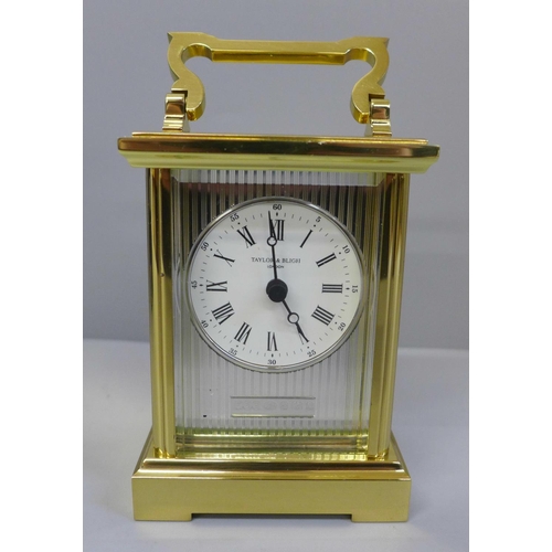 611 - A silver fronted brass carriage clock with purchaser's receipt, boxed