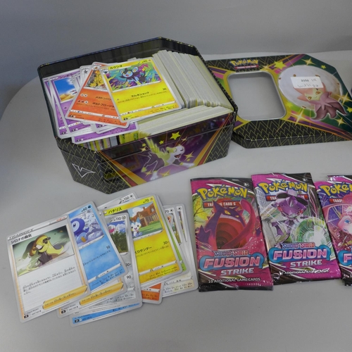 630 - A collection of Pokemon cards in two tins