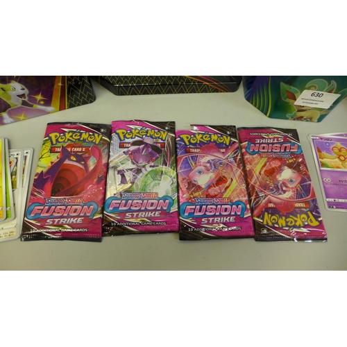 630 - A collection of Pokemon cards in two tins