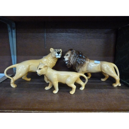 641 - A Beswick lion, lioness and cub ceramic figures