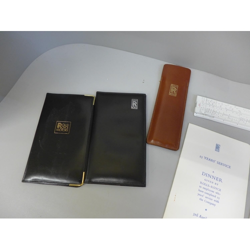 641C - A Rolls-Royce slide rule in leather case, as new, two Rolls-Royce leather note pads, a funeral card ... 