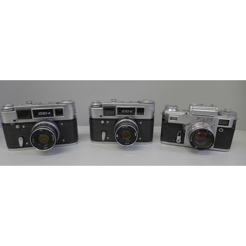 649 - Three Russian 35mm cameras and a collection of lenses