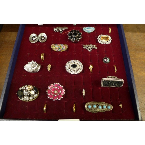 668 - Thirty-five dress rings in display case