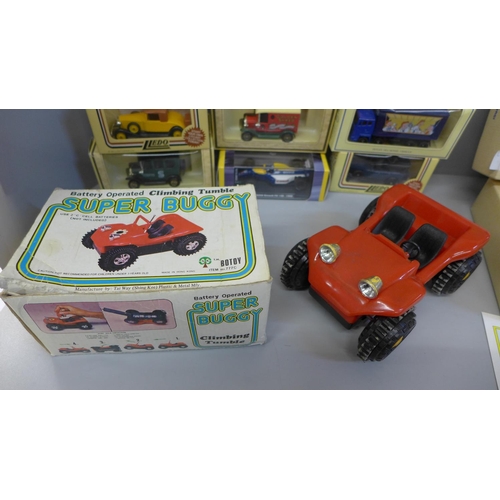 670 - A Corgi Toys Terrys of York van set, Lledo and other model vehicles and a battery operated Super Bug... 